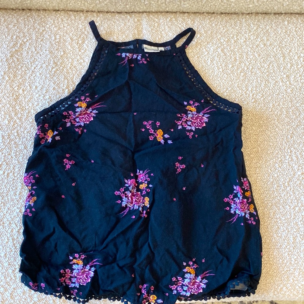 Black floral tank from Mudd Girl. Black background with floral design